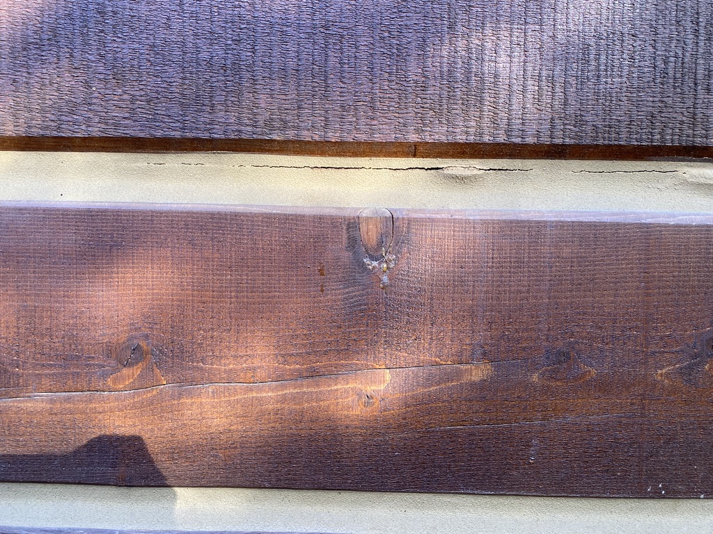Close-up of cracked chinking that needs replacement