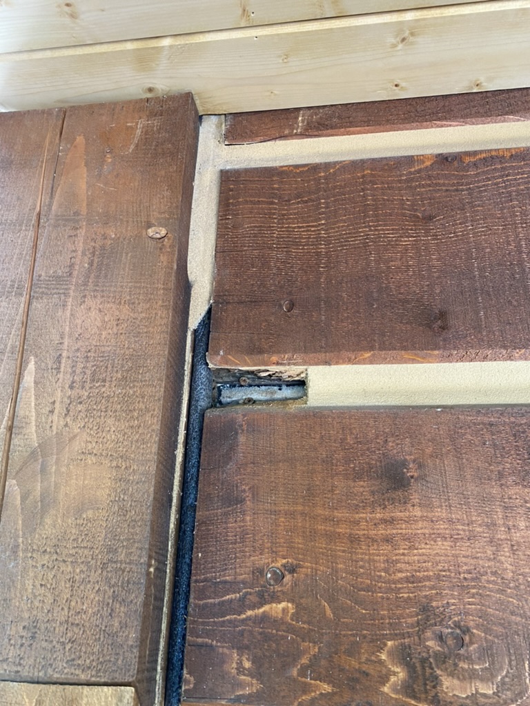 Window trim caulking and sealing detail on log home